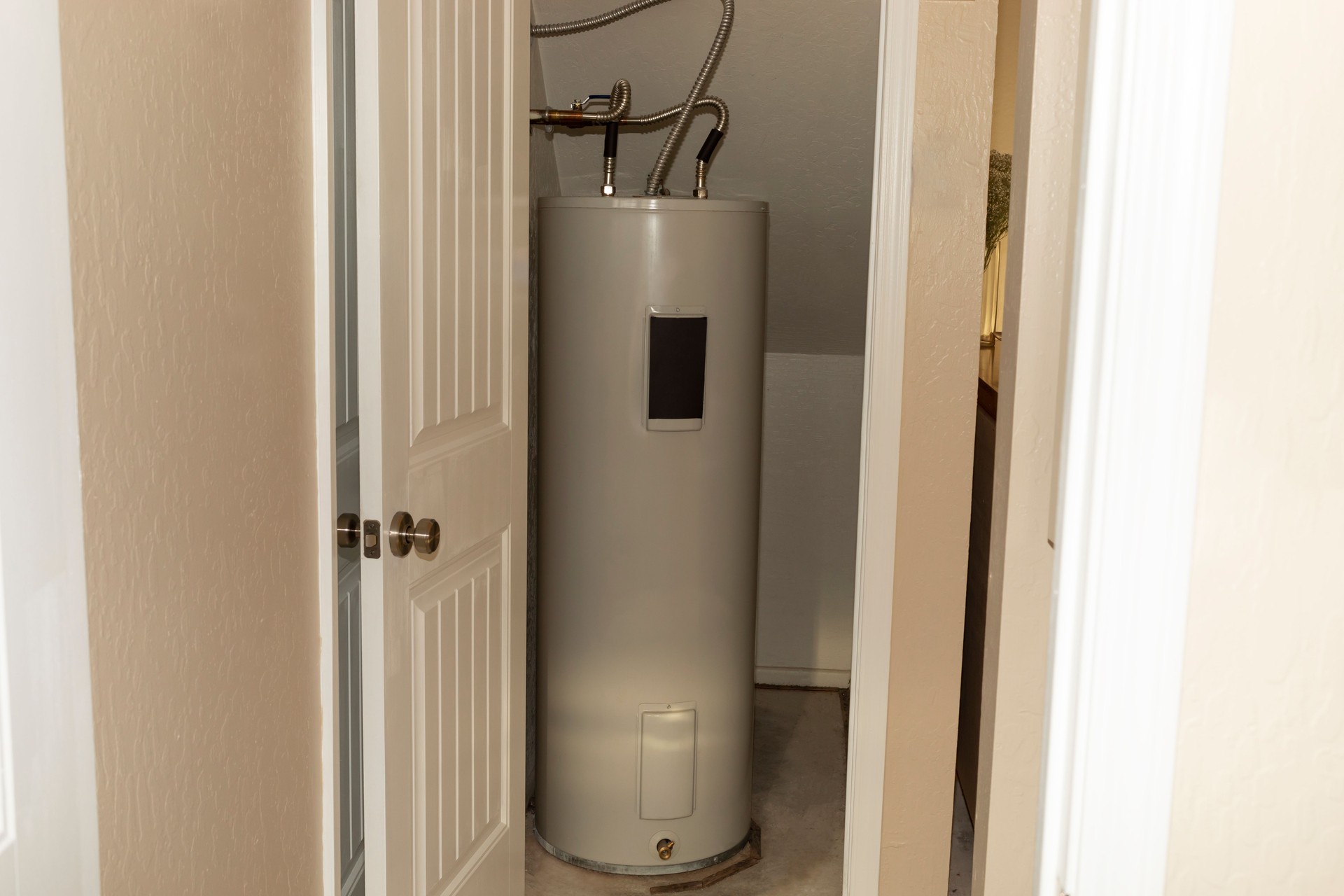 Automatic Storage Water Heater 75 Gal In Storeroom. Modern Electric Boiler, Water Tank in Storehouse In House. Horizontal Plane